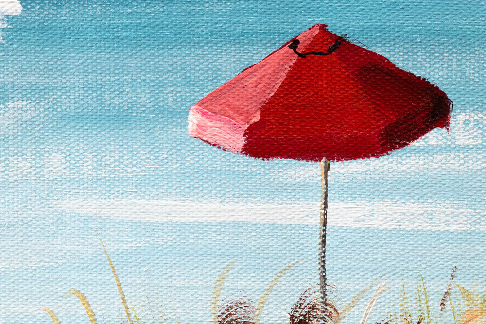 Az ecsetvonások részlete a kézzel festett képen, strand témával, kék és bézs árnyalatokkal – közeli nézet a festékrétegekről.