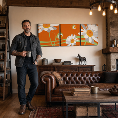 Kézzel festett POP Art virágkép 3 darab flo6 – kép modern férfi belső térben, lifestyle vizualizáció. Domináns színek: narancssárga, fehér, zöld, sárga.